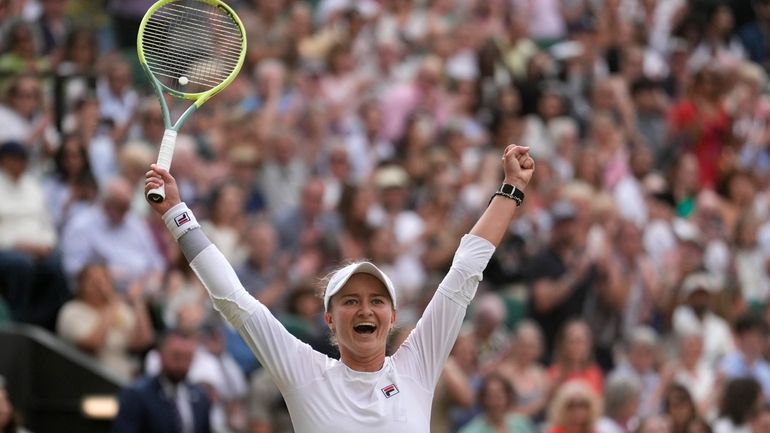 Barbora Krejcikova of the Czech Republic celebrates after defeating Elena...