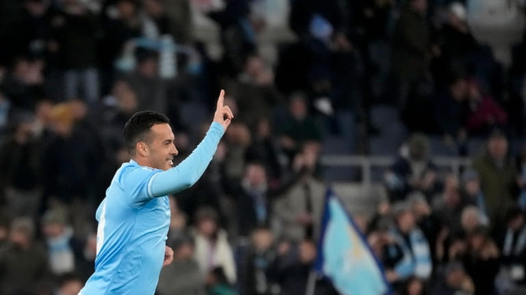 Lazio's Pedro celebrates after he scored his side's first goal...