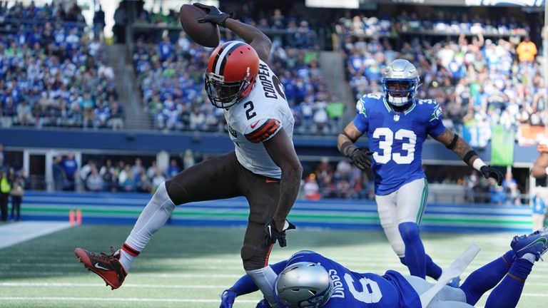 Cleveland Browns wide receiver Amari Cooper (2) is tripped up...