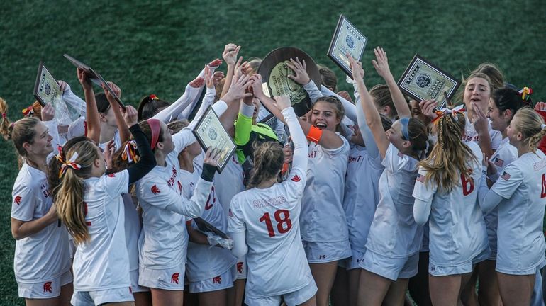 Sacred Heart celebrates its victory against St. Joseph by-the-Sea during...