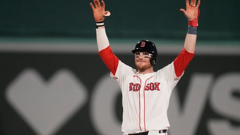 Boston Red Sox's Danny Jansen celebrates after hitting an RBI...