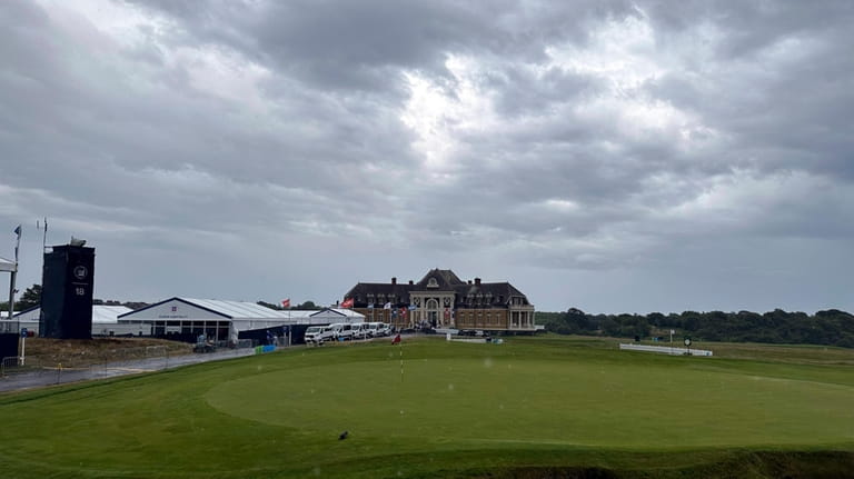Rain falls on the clubhouse at Newport Country Club, Sunday,...