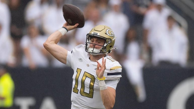 Georgia Tech quarterback Haynes King (10) throws on the run...