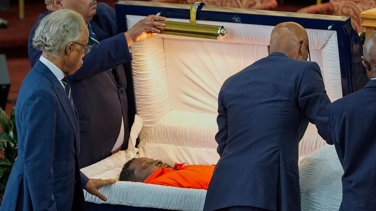 Rev. Al Sharpton pauses at the funeral for D'Vontaye Mitchell,...