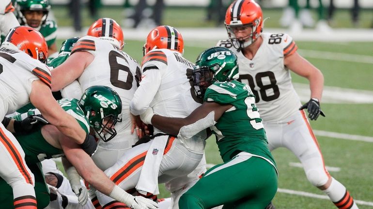 Tarell Basham #93 of the Jets stops Baker Mayfield #6 of...