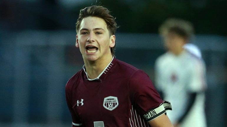 Garden City’s Tommy Poz celebrates his second goal of game during...