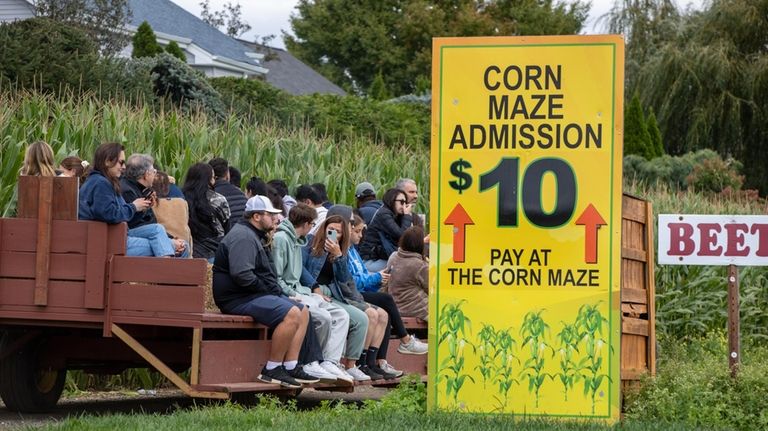 A hayride heads toward the corn maze at Schmitt's Farm in...