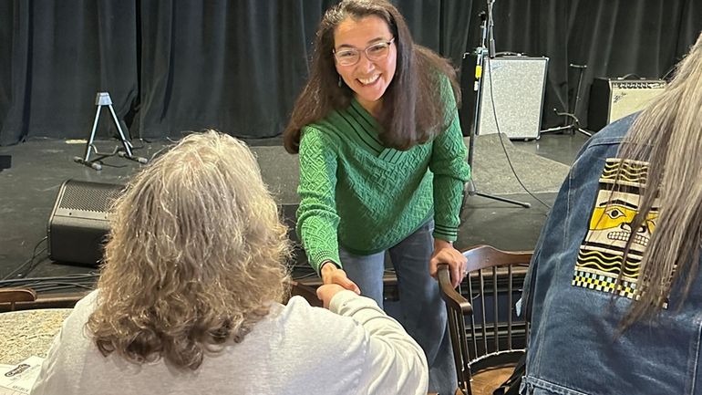 Alaska U.S. Rep. Mary Peltola shakes hands after entering a...