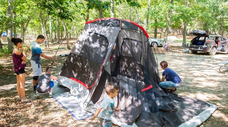 Zoeller family, of North Babylon, set up their campsite at...