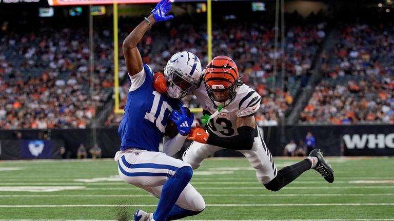 Indianapolis Colts wide receiver Adonai Mitchell (10) breaks a tackle...