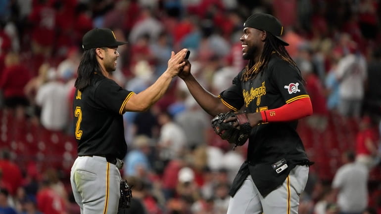 Pittsburgh Pirates' Oneil Cruz, right, and teammate Connor Joe (2)...