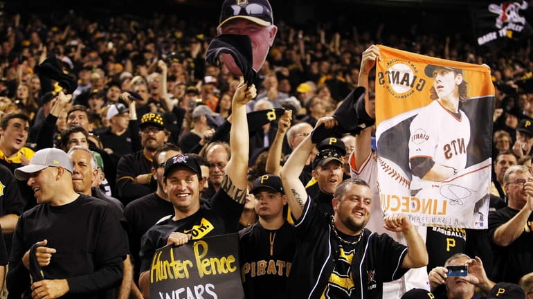 Pittsburgh Pirates fans cheer during their National League Wild Card...