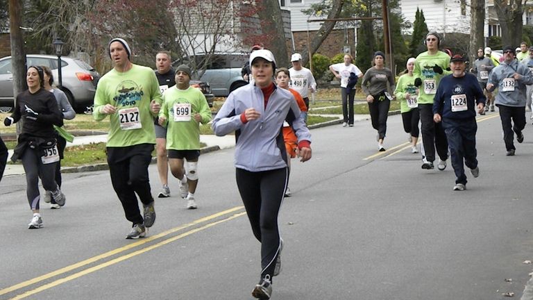 Port Washington resident Rachel Fox (center), pictured here in the...