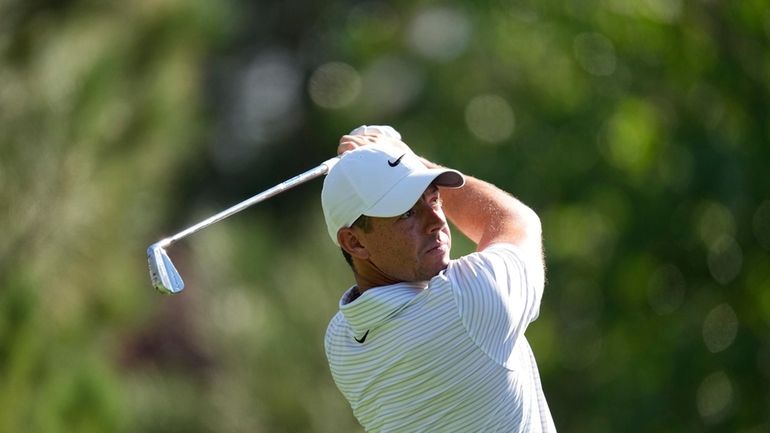 Rory McIlroy of Northern Ireland tees off on the fourth...