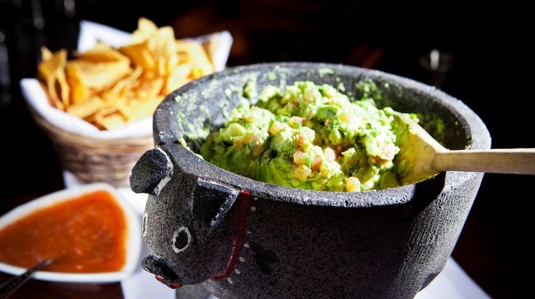 Tableside guacamole is a specialty at Besito in Huntington, but...