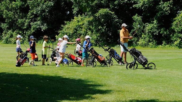 Young golfers participate in junior golf camp at Poxabogue Golf...