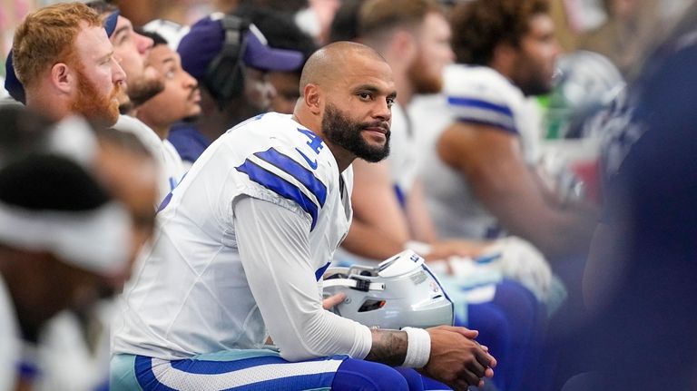 Dallas Cowboys quarterback Dak Prescott sits on the bench during...