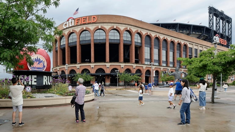 Fans leave Citi Field after Monday's game between the Mets and the Dodgers...
