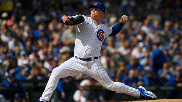 Chicago Cubs starter Jordan Wicks delivers a pitch during the...