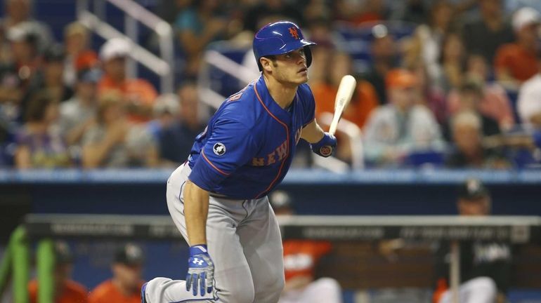 The Mets' Anthony Recker singles during the fourth inning of...