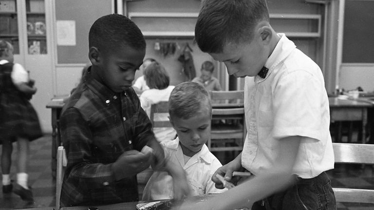 From left, first-grade classmates Mark Johnson, Tommy Haberle and Tommy...