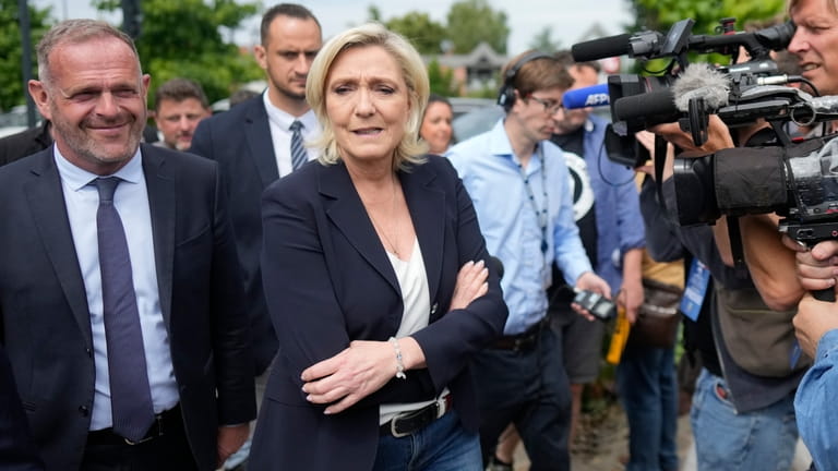 French far right leader Marine Le Pen, center, with local...