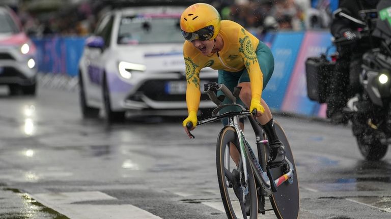 Grace Brown, of Australia, competes in the women's cycling time...