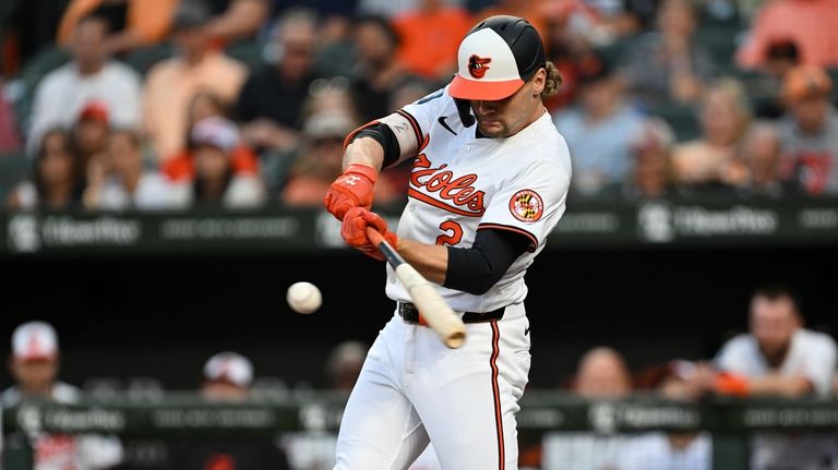 Baltimore Orioles' Gunnar Henderson hits a double against Houston Astros...