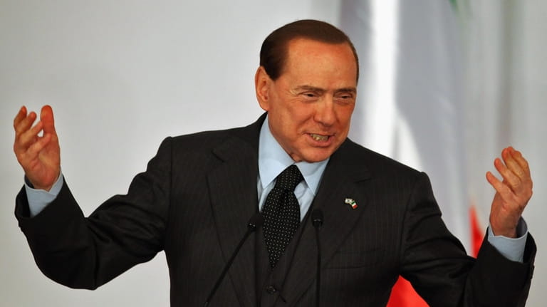 Visiting Italian Prime Minister Silvio Berlusconi gestures during a press...