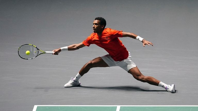 Canada's Felix Auger Aliassime makes a return against Finland's Otto...