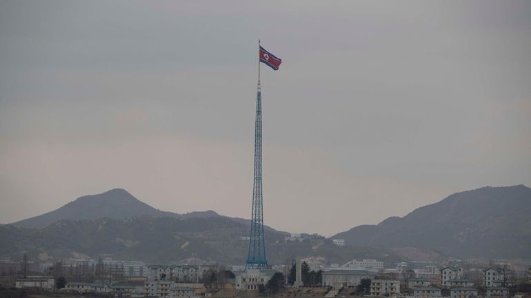 A North Korean flag flutters in North Korea's village Gijungdong...