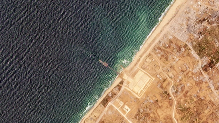 This satellite image from Planet Labs PBC shows a pier...