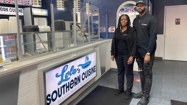 Tiffany and Darrell Darwood inside their restaurant, Lola's Southern Cuisine...