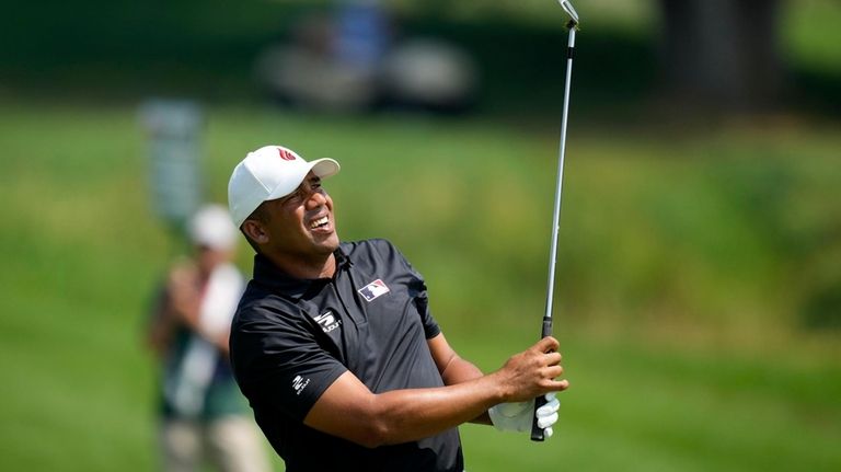 Jhonattan Vegas hits on the fairway on the seventh hole...