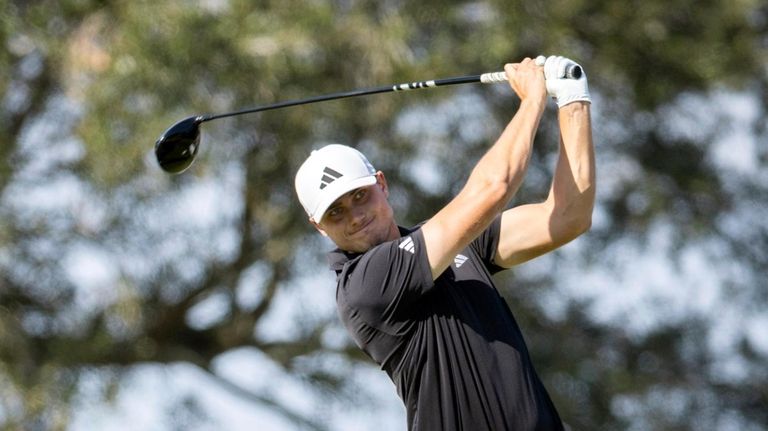 Ludvig Aberg, of Sweden, watches his drive off the seventh...