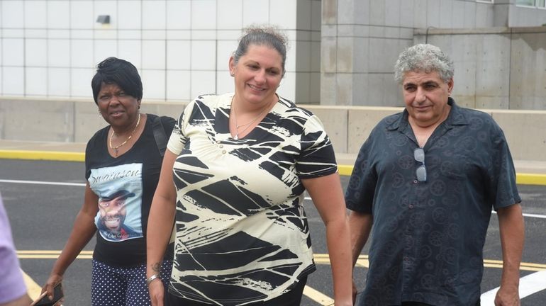 Family members of victims leave court after the sentencing of...