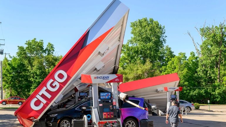 Powerful storms the night before left a gas station heavily...