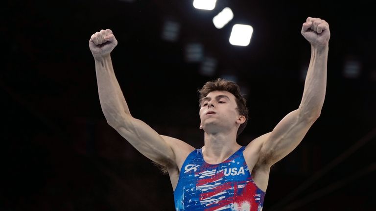 Stephen Nedoroscik, of United States, celebrates after competing on the...