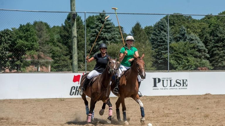 Christen Crowley, left, of Baiting Hollow, and Gretchen Persan practice bumping at...