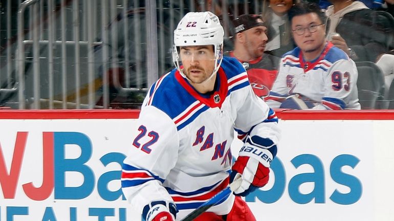 Ryan Carpenter #22 of the New York Rangers skates against...