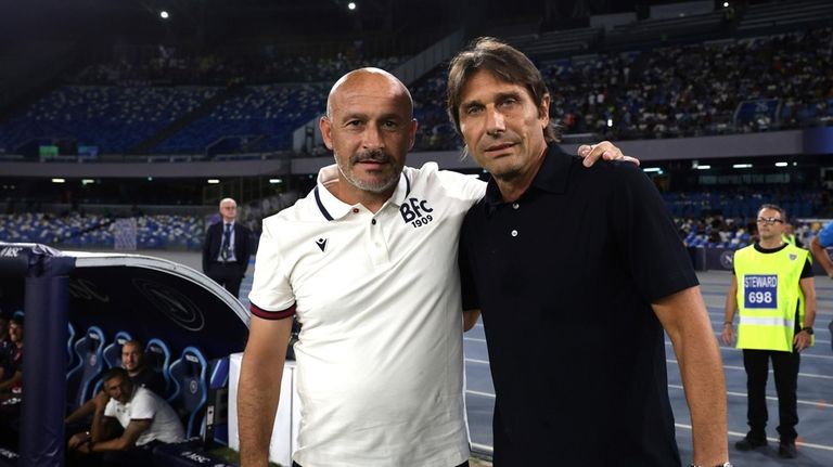 Bologna's head coach Vincenzo Italiano, left, poses for a photo...