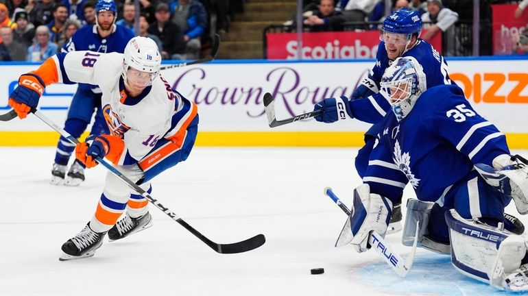 Islanders' Pierre Engvall (18) scores against Toronto Maple Leafs goaltender...