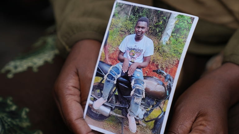 Edith Wanjiku shows a photo of his son 19-year-old Ibrahim...