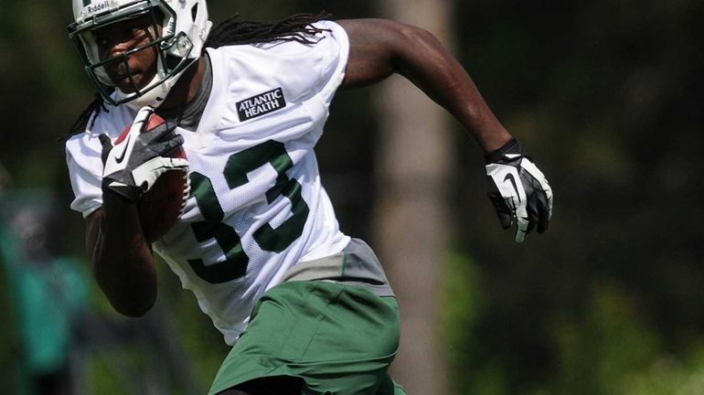 Jets running back Chris Ivory rushes during team OTAs. (June...