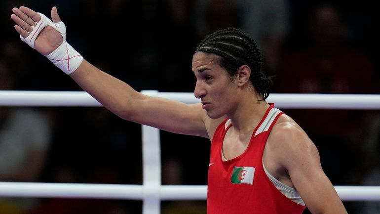 Algeria's Imane Khelif, celebrates after defeating Hungary's Anna Hamori in...