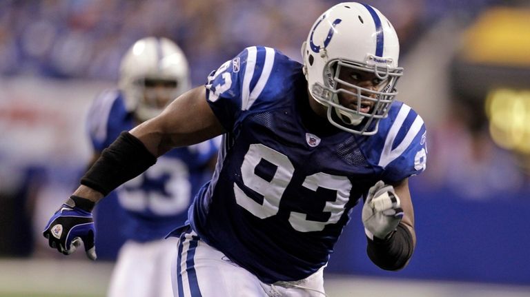 Indianapolis Colts defensive end Dwight Freeney (93) rushes in during...