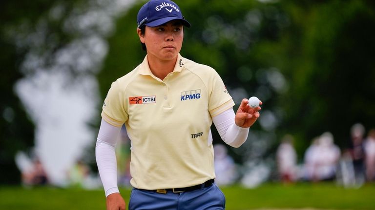 Yuka Saso, of Japan, walks on the 14th green during...