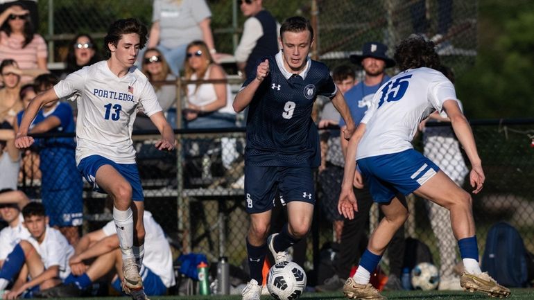 James Fay of The Stony Brook School moves toward the...