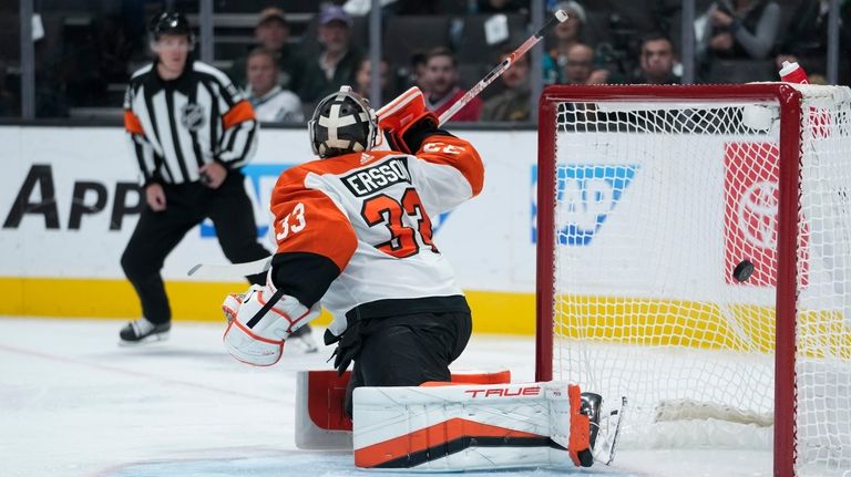 Philadelphia Flyers goaltender Samuel Ersson is unable to stop a...