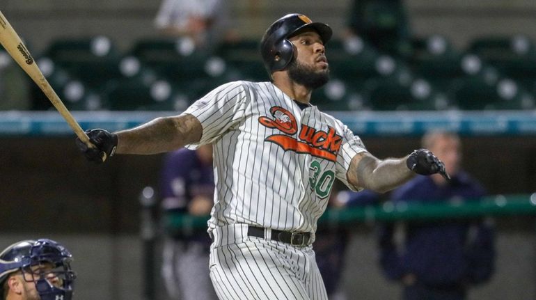 David Washington #30 of the Long Island Ducks hits his...